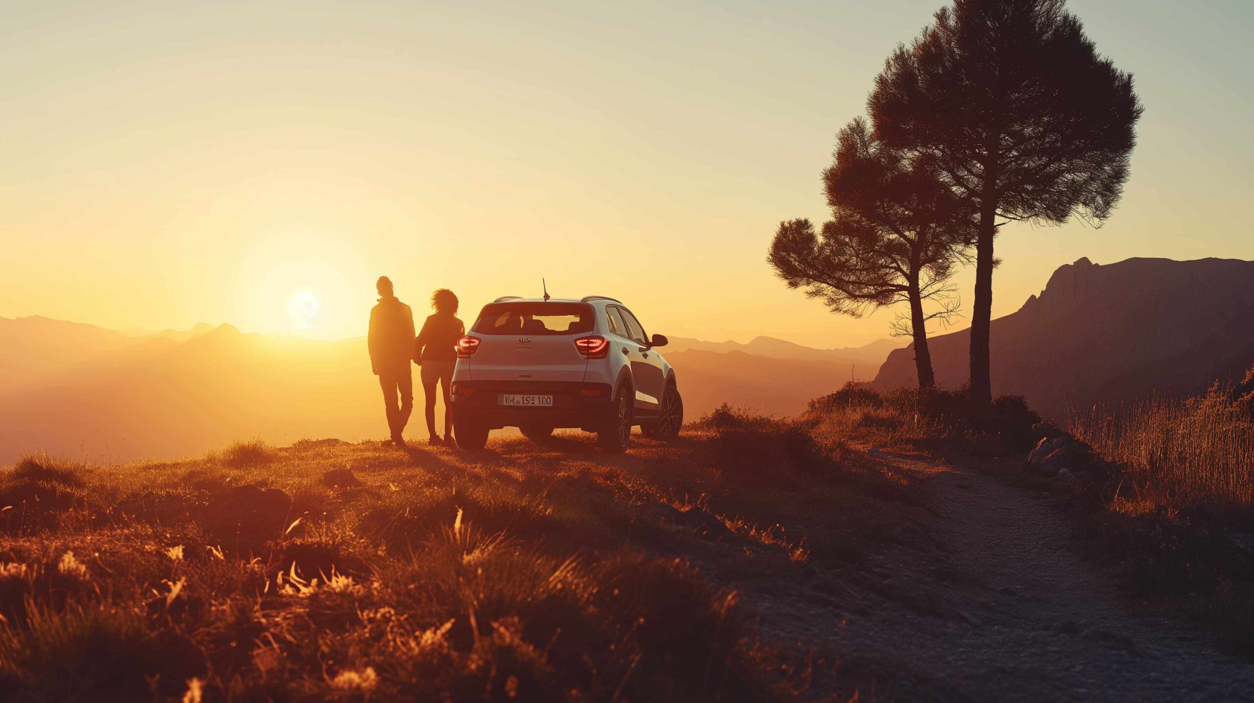 couple-standing-dirt-road-with-car-sun-setting-them (1) (1) (1)